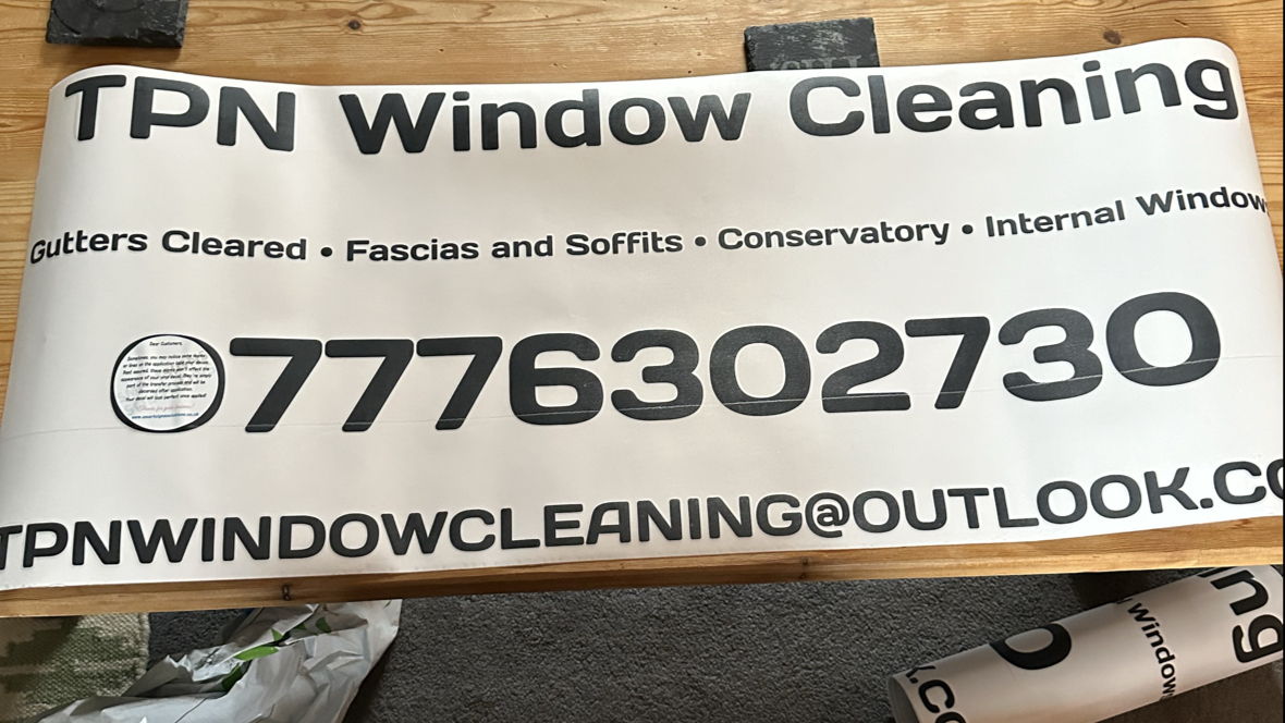 The TPN Window Cleaning van banner listing gutters cleared, fascias and soffits, conservatory and internal windows